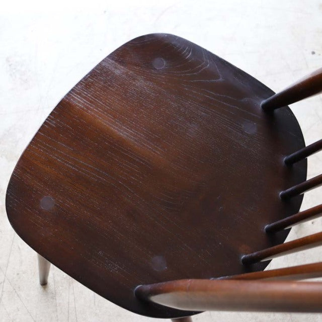 Set of four vintage British Arcol Goldsmith high-back dining chairs in rich teak with smooth wood grain and slender spindle.
