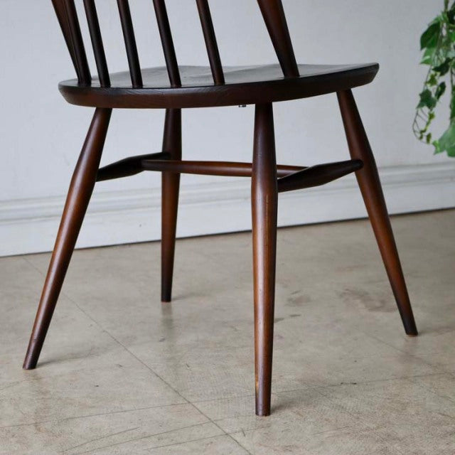 Set of four British mid-century Arcol Goldsmith high-back dining chairs in rich teak with visible wood grain and tapered legs.