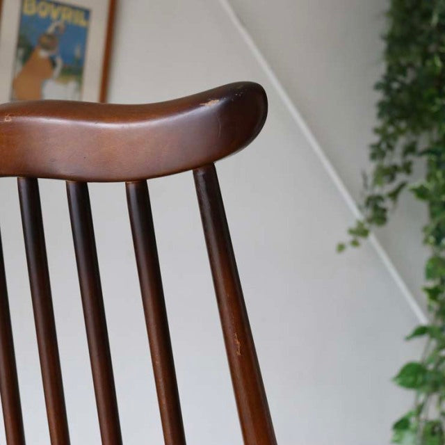 Vintage mid-century British Ercol Goldsmith dining chair in rich teak with curved top rail and slender spindle backrest.