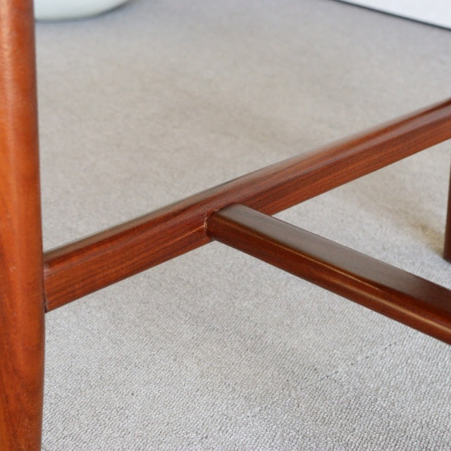 Mid-century British vintage teak dining chair leg with rich wood grain and sturdy construction.