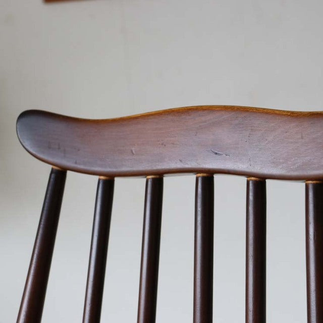 Mid-century British vintage Ercol Goldsmith dining chair backrest in warm teak wood with smooth curved top rail and slender.