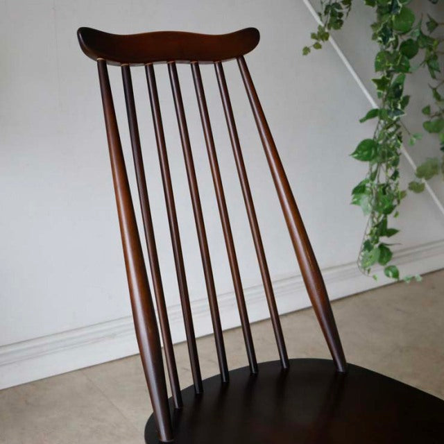 Vintage British mid-century teak dining chair by Ercol with vertical spindle back and tapered legs.