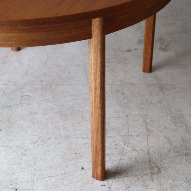 Mid-century vintage Alfred Cox round dining table in teak with smooth grain and tapered wooden legs, British design from.