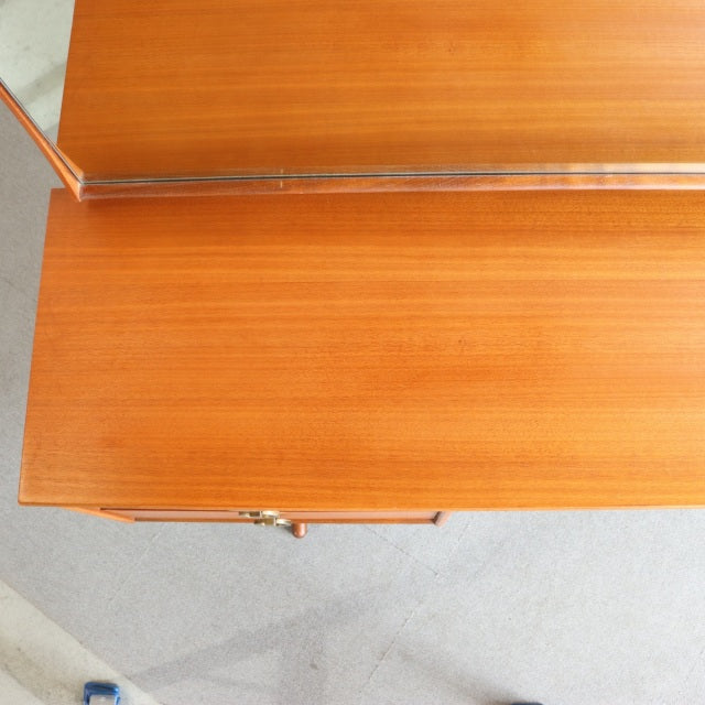 Vintage mid-century teak dressing table top with fine wood grain and brass details from British Austinsuite furniture.