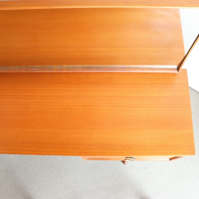 Mid-century British vintage teak dresser with smooth wood grain and clean lines, part of Austinsuite collection.