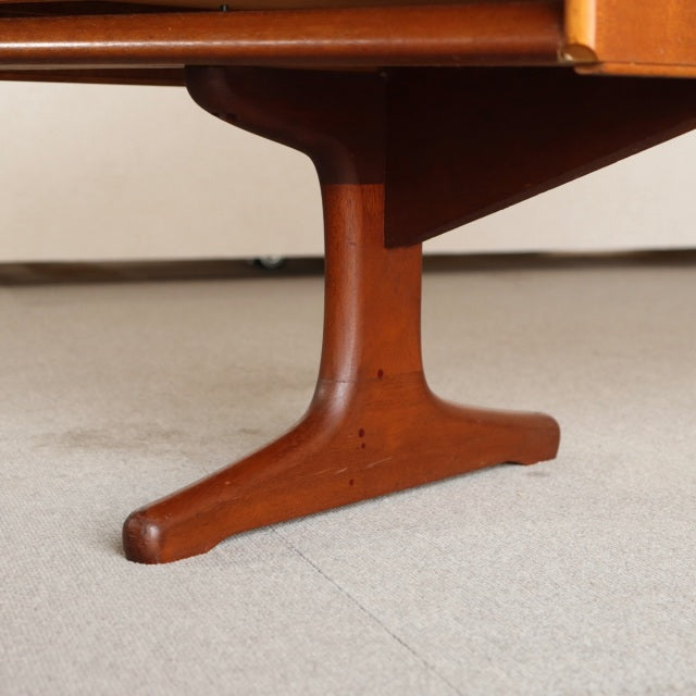 Mid-century teak wood dresser leg with smooth grain and rounded edges, showcasing vintage British-Denmark design.