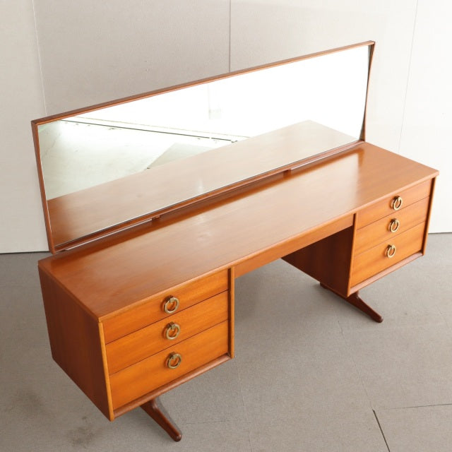 Mid-century British teak dressing table by Austinsuite with rectangular mirror, twin drawers on each side, and tapered legs.