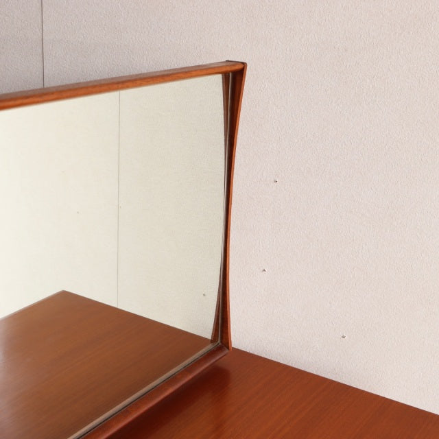 Mid-century British vintage teak dresser mirror with clean lines and warm wood grain finish.