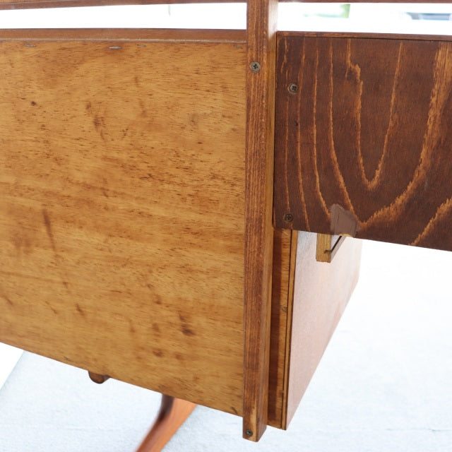 Vintage mid-century teak dresser drawer corner showing rich wood grain and smooth edges, British-Denmark design.