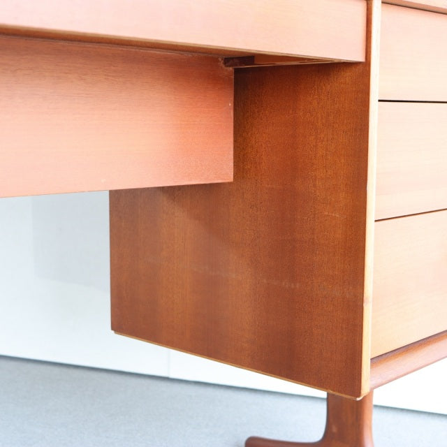Mid-century British teak dresser corner view showing rich wood grain and clean lines by Austinsuite.