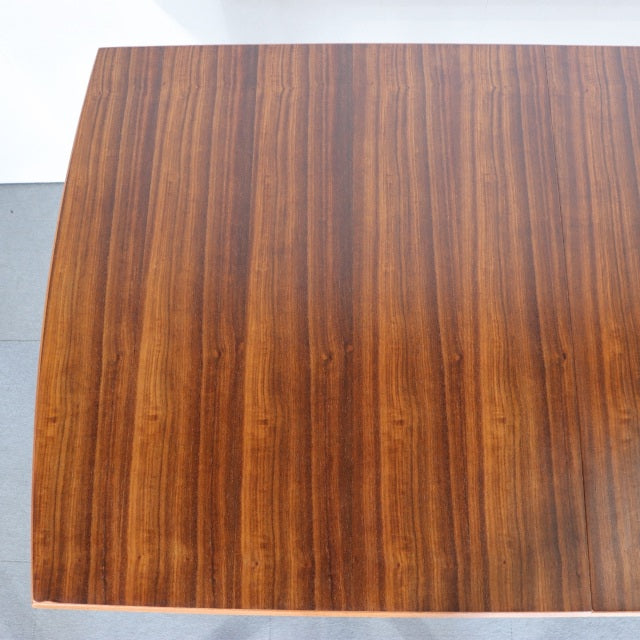 Vintage teak dining table top with rich wood grain, mid-century British or Danish design, rectangular shape.