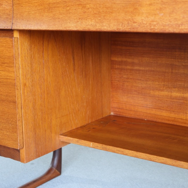 Mid-century British vintage teak dresser shelf with warm wood grain and smooth finish.