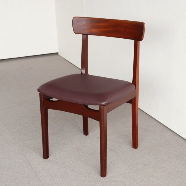 Vintage mid-century teak dining chair by Younger with rich wood grain and burgundy leather seat upholstery from Denmark.