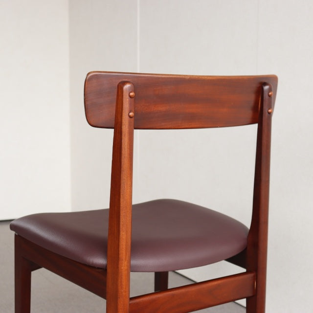 Vintage mid-century teak dining chair by Younger, British design with smooth wood grain and dark brown leather seat.