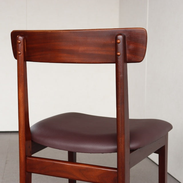 Vintage teak dining chair by Younger, British mid-century design with rich wood grain and newly reupholstered seat in dark.