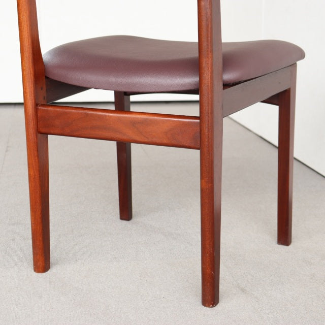 Mid-century vintage teak dining chair from British brand Younger with smooth wood grain and brown upholstered seat.