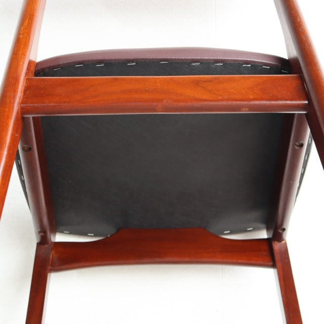 Mid-century vintage British teak dining chair by Younger, showing underside with rich wood grain and sturdy frame.