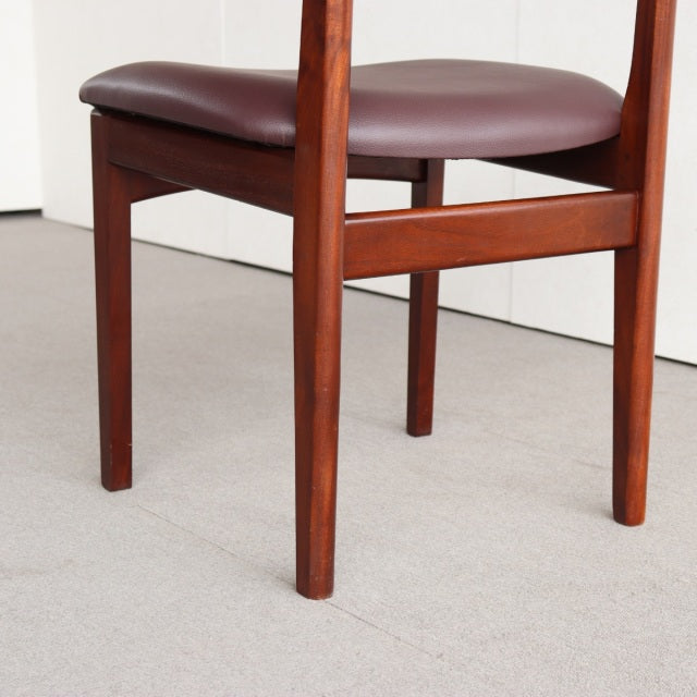 Vintage teak Younger dining chair with smooth wood grain, mid-century British design, brown leather seat upholstery, clean.