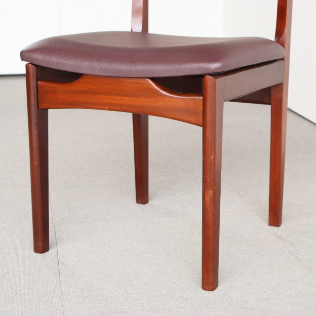 Vintage mid-century teak dining chair from British YOUNGER brand with smooth wood grain and brown leather seat cushion.