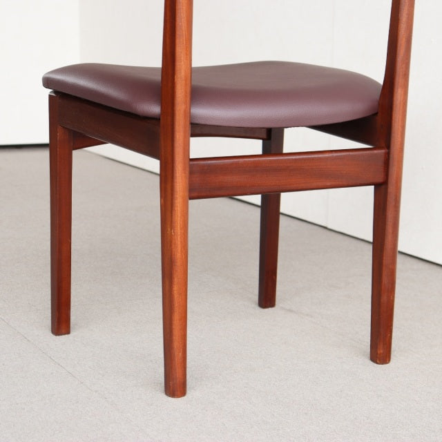 Mid-century British YOUNGER dining chair in vintage teak with clean wood grain and brown leather seat cushion.