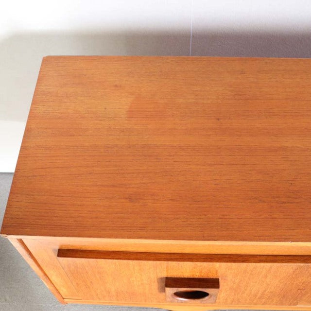 Vintage mid-century British teak sideboard top showing rich wood grain and smooth finish with minimalist rectangular form.
