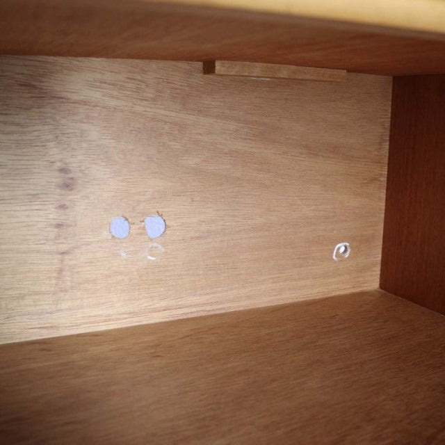 Interior view of vintage teak sideboard showing smooth wood grain and clean mid-century craftsmanship typical of British and .