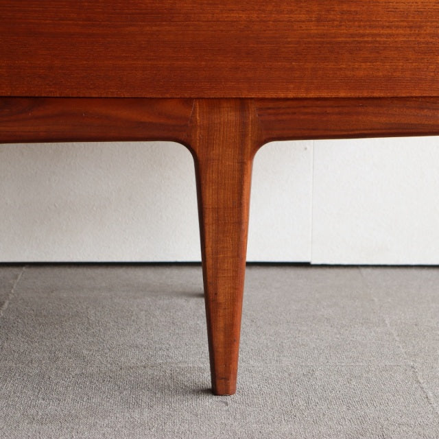 Mid-century British vintage teak sideboard leg with smooth wood grain and tapered design from Younger Fonseca series.