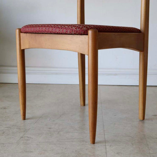 Set of two vintage mid-century teak dining chairs with tapered legs and red floral upholstered seats, British-Denmark design .