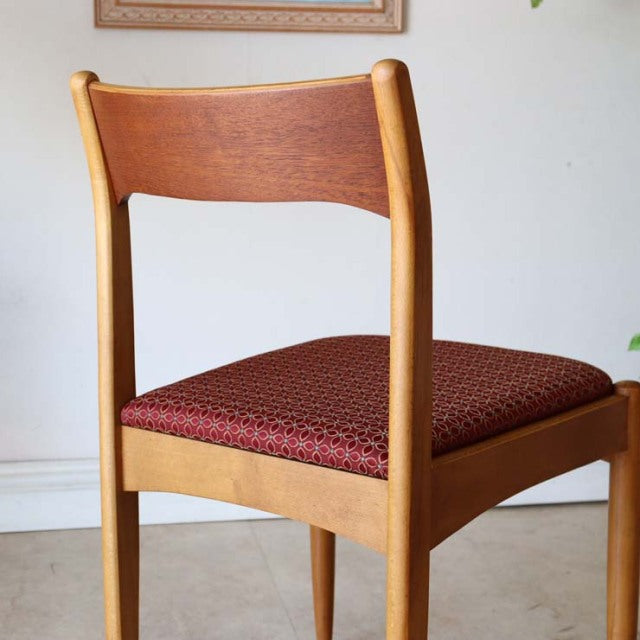 Vintage mid-century teak dining chair from British-Denmark design with curved backrest and patterned flower seat upholstery.