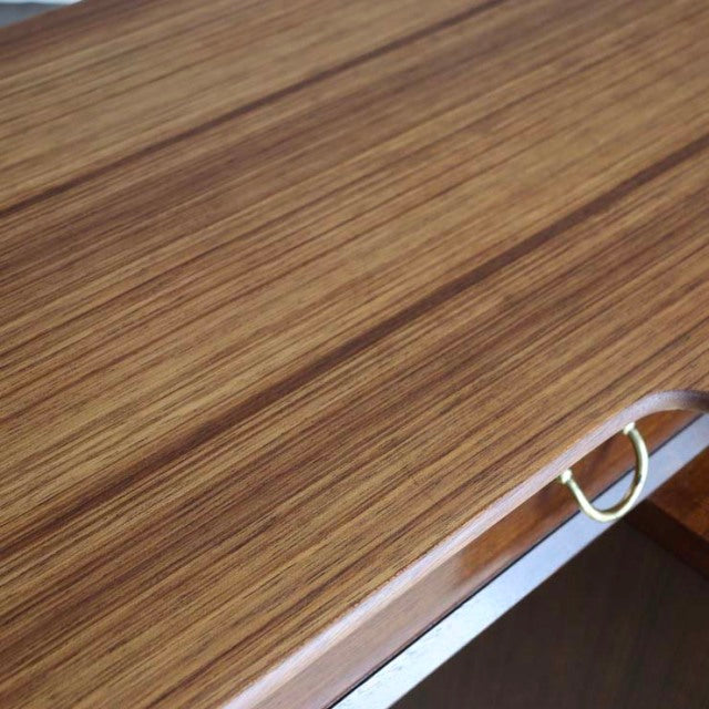 Vintage teak desk surface showcasing rich wood grain and elegant mid-century British design from G-PLAN.