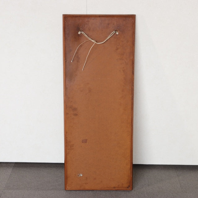 Vintage British mid-century teak rectangular wall mirror with visible wood grain and mounted hanging cord on back panel.