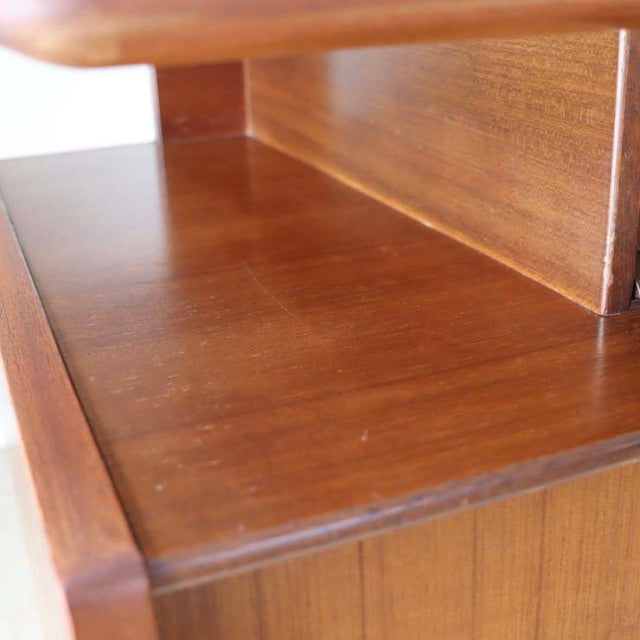 Close-up of vintage teak desk surface showing rich wood grain and smooth mid-century British craftsmanship by G-PLAN.