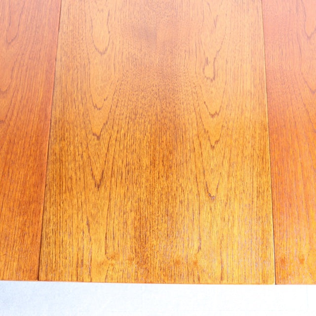 Mid-century vintage teak dining table top with distinct British-Denmark wood grain patterns.