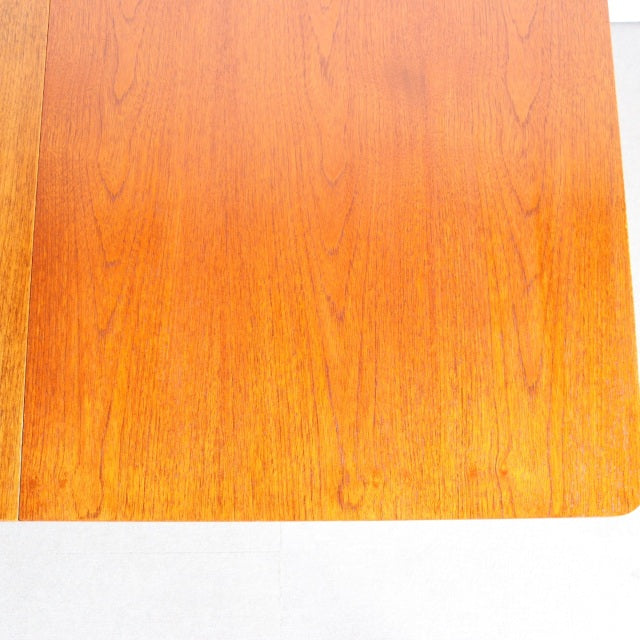 Vintage mid-century teak dining table top with rich wood grain and smooth rectangular form from Britain and Denmark style.