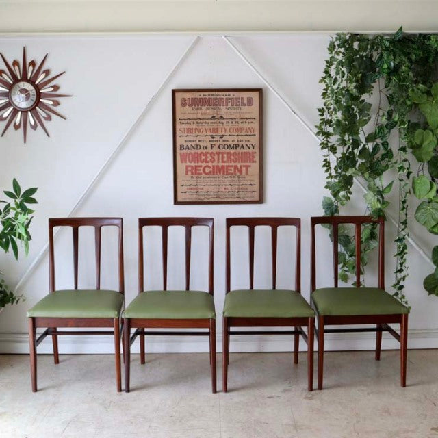 Set of four vintage teak dining chairs by A.Younger Ltd., mid-century British design with green upholstered seats and.