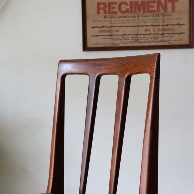 Mid-century British dining chair by A.Younger Ltd. in polished teak with sleek, tapered legs and sculpted backrest featuring .