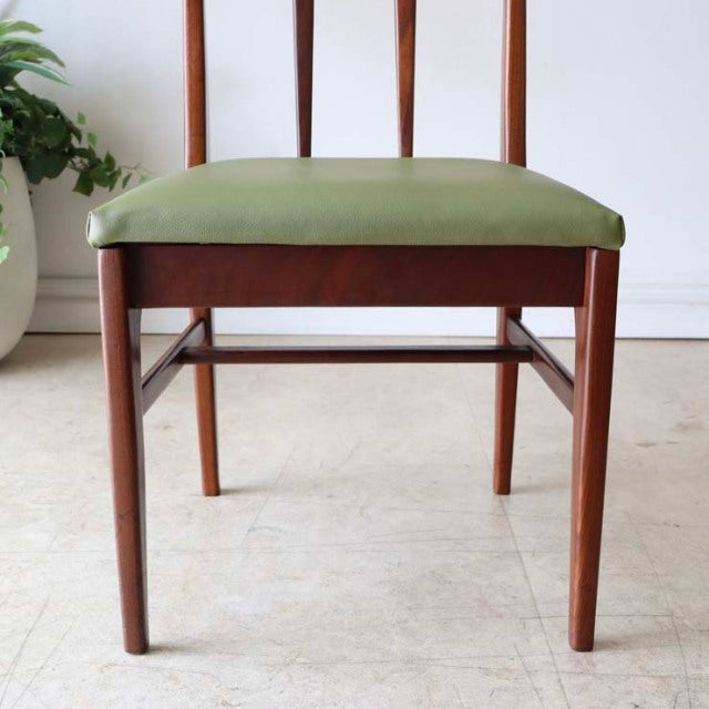 Mid-century British vintage teak dining chair by A.Younger Ltd. with olive green upholstered seat and slender tapered legs.