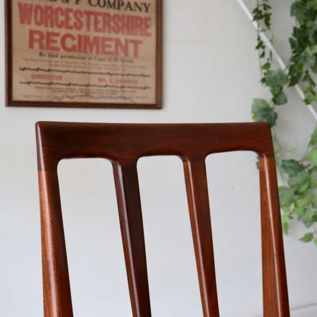 Vintage teak dining chair by A.Younger Ltd., British mid-century design by John Herbert Fonseca, featuring rich wood grain.