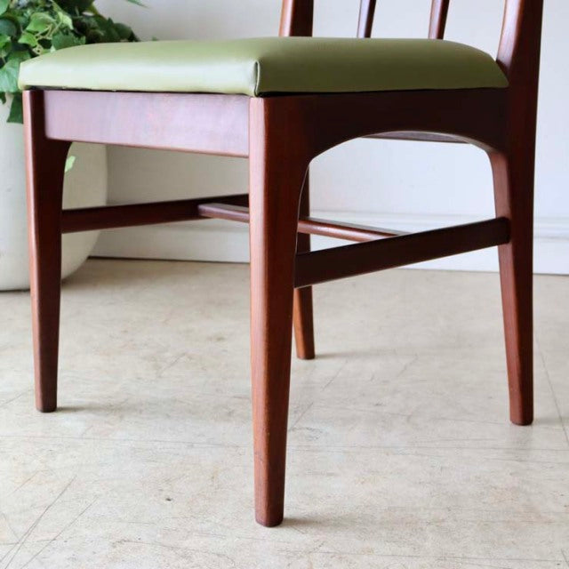Mid-century vintage teak dining chair by A.Younger Ltd., British design with sleek tapered legs and light green upholstered.