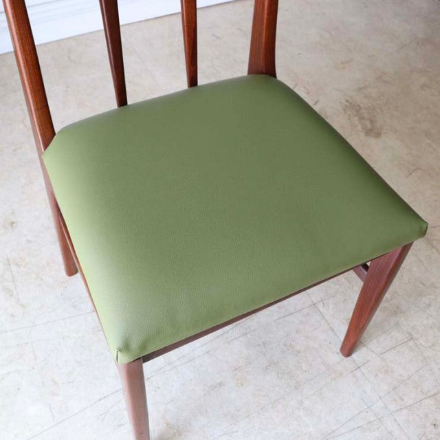 Mid-century British vintage teak dining chair by A.Younger Ltd. with olive green upholstered seat and slender spindle.