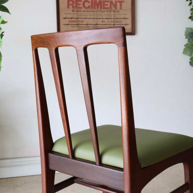 Set of four vintage mid-century teak dining chairs by A.Younger Ltd., British design with slatted backrests and olive green.