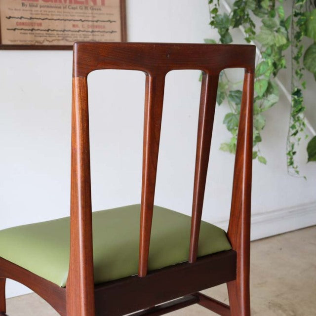Vintage mid-century teak dining chair by A.Younger Ltd., British design with slim vertical slats and olive green upholstered .