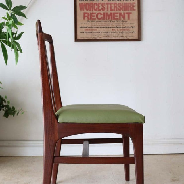 Vintage British teak dining chair by A.Younger Ltd. with sleek mid-century Danish design, green upholstered seat, and.