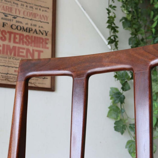 Vintage British mid-century teak dining chair by A.Younger Ltd., smooth wood grain, elegant curved backrest, slender tapered .