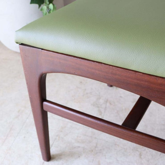 Mid-century British teak dining chair by A.Younger Ltd., olive green leather seat, smooth wood grain, angled legs, Danish.