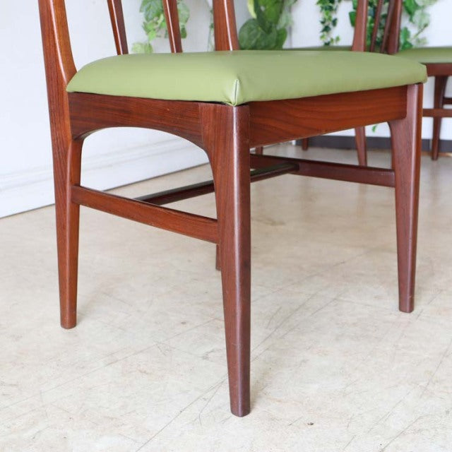 Mid-century British teak dining chair by A.Younger Ltd., sleek wood grain, slender legs, green upholstered seat.