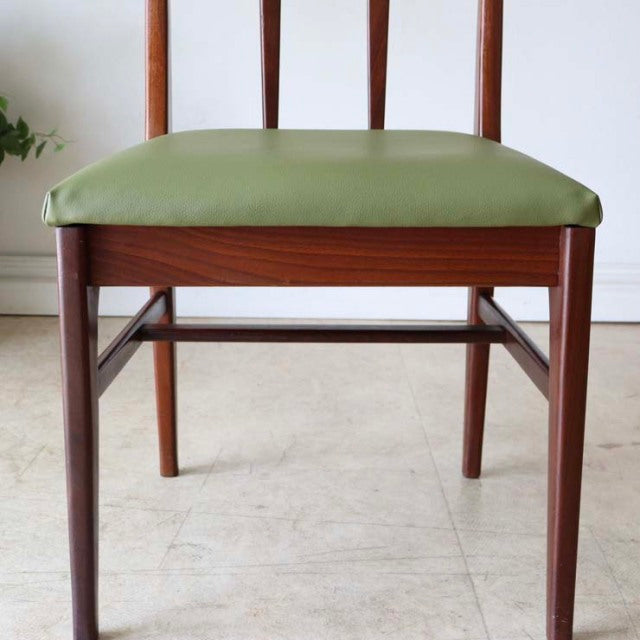 Vintage mid-century teak dining chair by A.Younger Ltd., British design with slender tapered legs and olive green cushioned.
