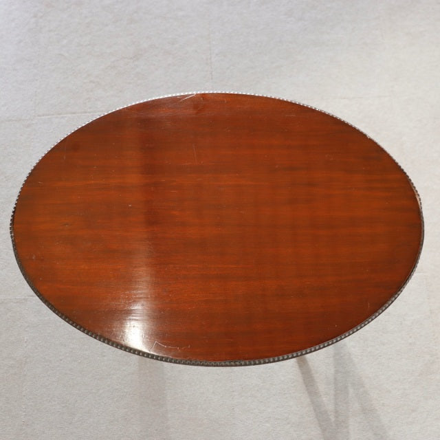 Oval vintage teak nest table top with smooth wood grain and polished mid-century British finish.