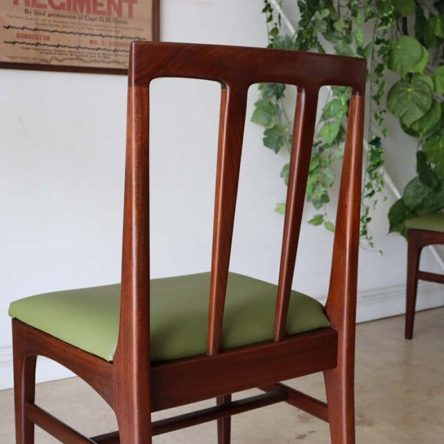 Vintage British mid-century dining chair by A.Younger Ltd. in teak with green upholstered seat and tapered backrest slats.