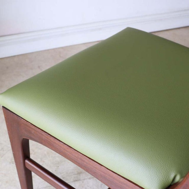 Mid-century British vintage teak dining chair by A.Younger Ltd. with olive green leather seat and clean-lined angled legs.